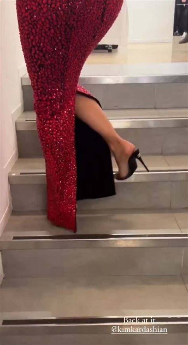 
Watch Kim Kardashian Struggle to Climb the Stairs in Skin-Tight Dolce & Gabbana Dress 