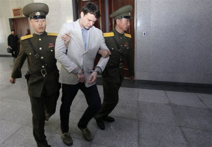 
What Happened To Otto Warmbier’s Teeth? Arrested And Prison Charges After Stealing Propaganda Poster 